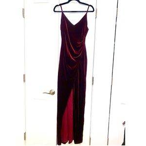 Beautiful Burgundy Velvet Evening gown. Front slit and completely lined.